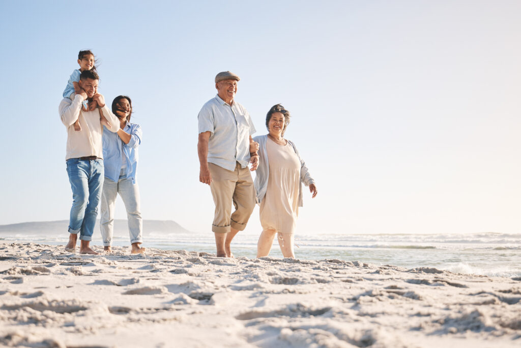 Three generations enjoying a walk on the beach—Healthy Weight For Life can help improve quality of life