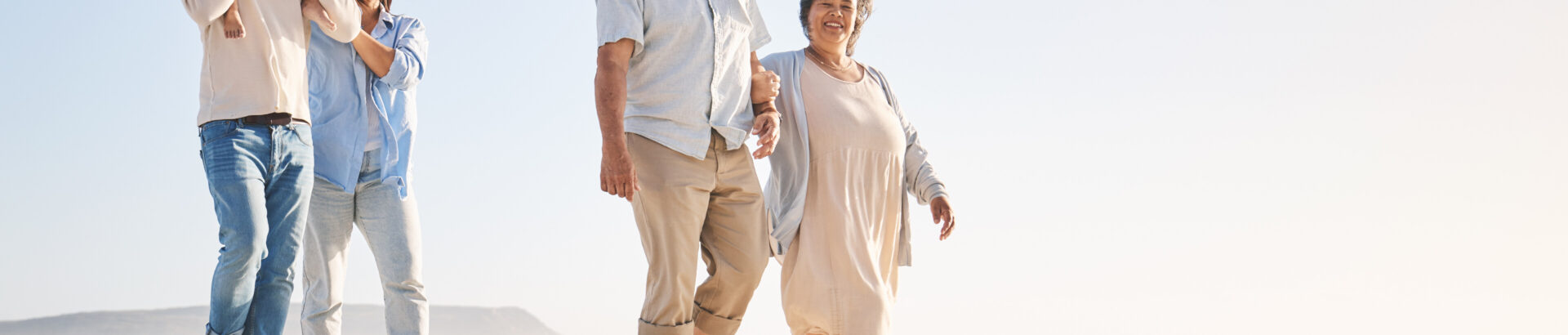 Three generations enjoying a walk on the beach—Healthy Weight For Life can help improve quality of life