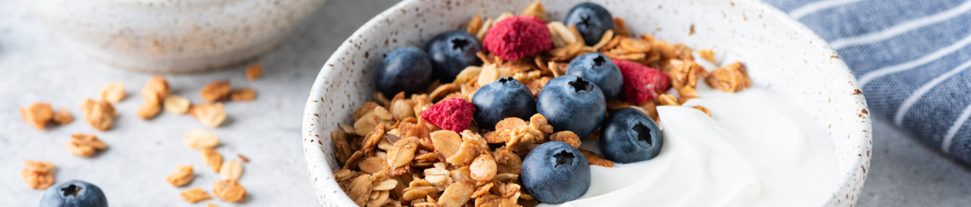 A simple, healthy breakfast suggestions of granola and low-calorie yoghurt.